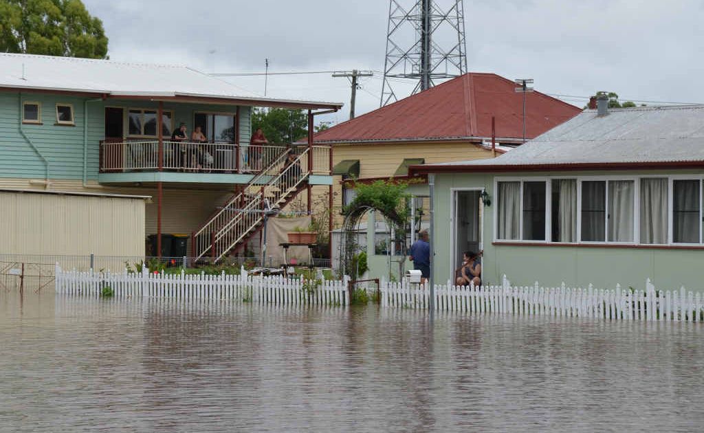Floodwater surrounded Dixie Gibson’s low-set Canning St home early Monday morning.